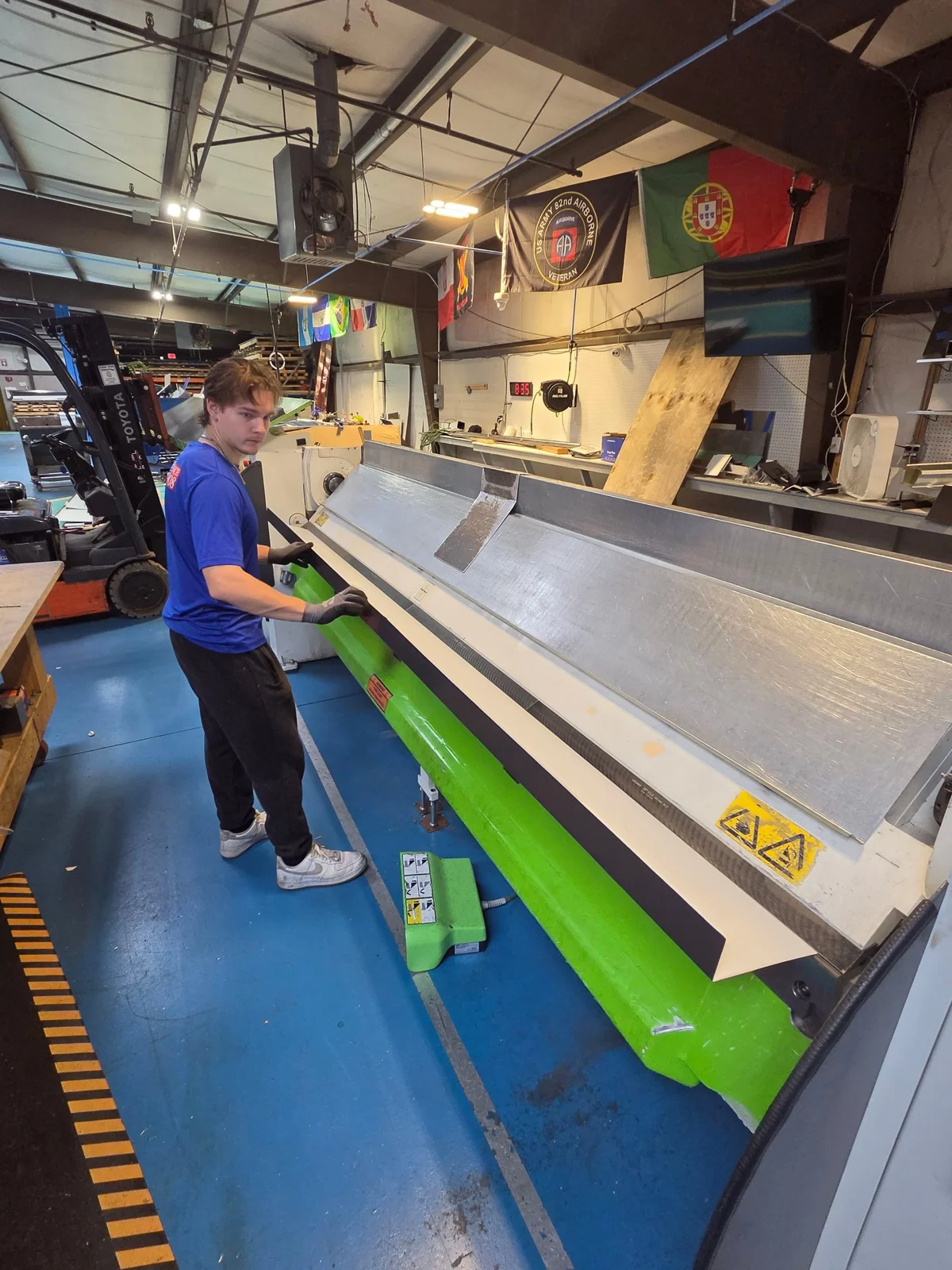 Chaffee shop team member working at the sheet-metal folding machine
